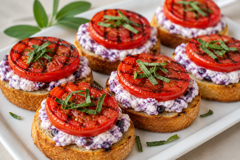 Grilled Tomatoes with Blueberry Goat Cheese on Crostini (A Little Daytime Drama)